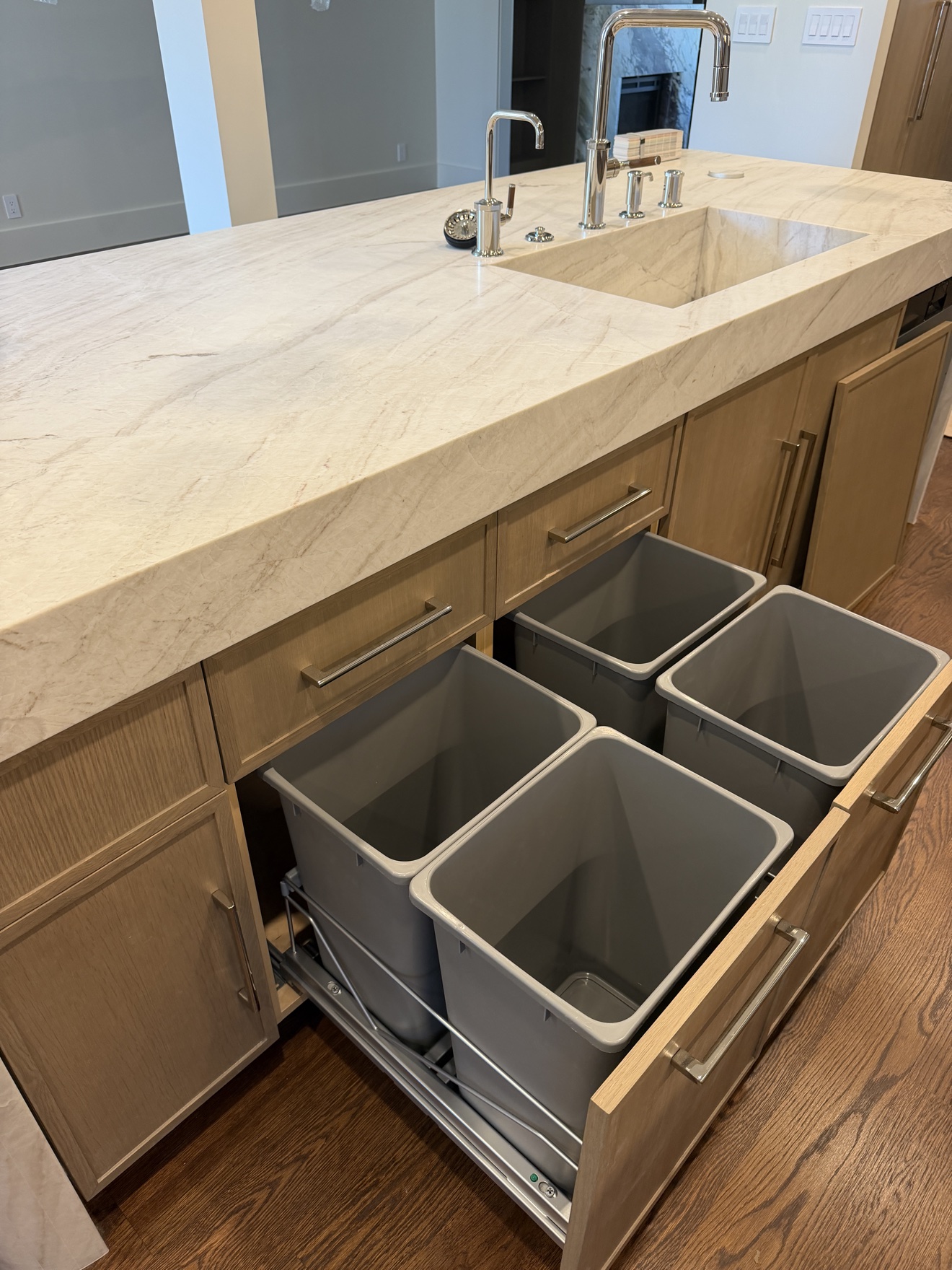 Open pull-out waste and recycling bins built into the Parker kitchen island