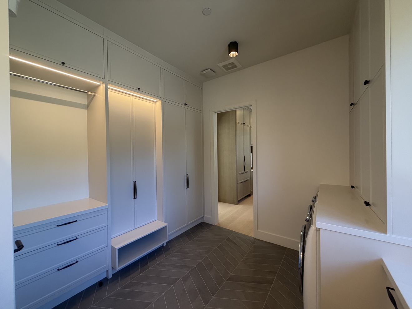 Hillsborough mudroom with built-in coat lockers, drawers, a shoe bench, and LED strip lighting