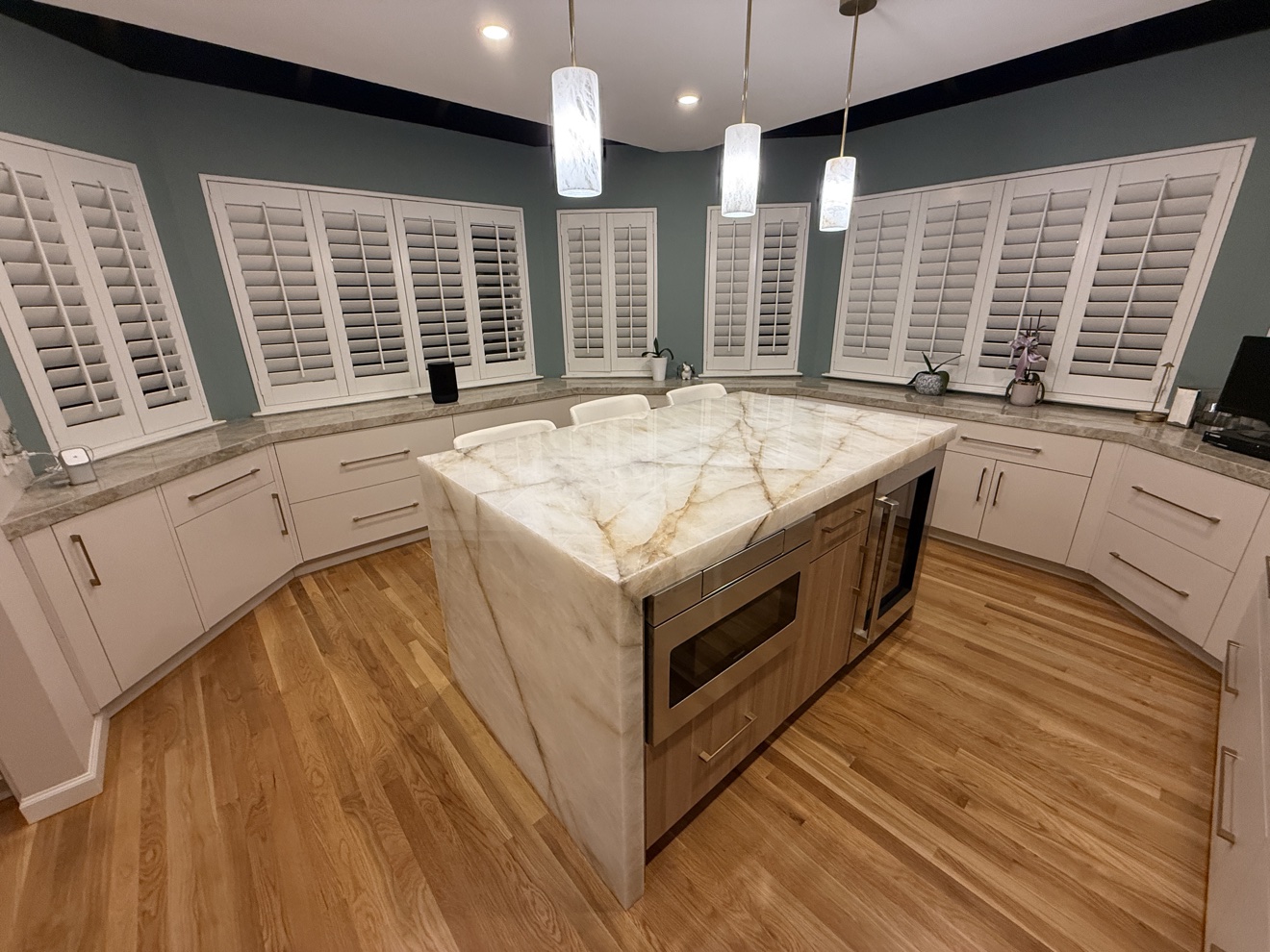 Kenwood St white kitchen viewed in full across the onyx island